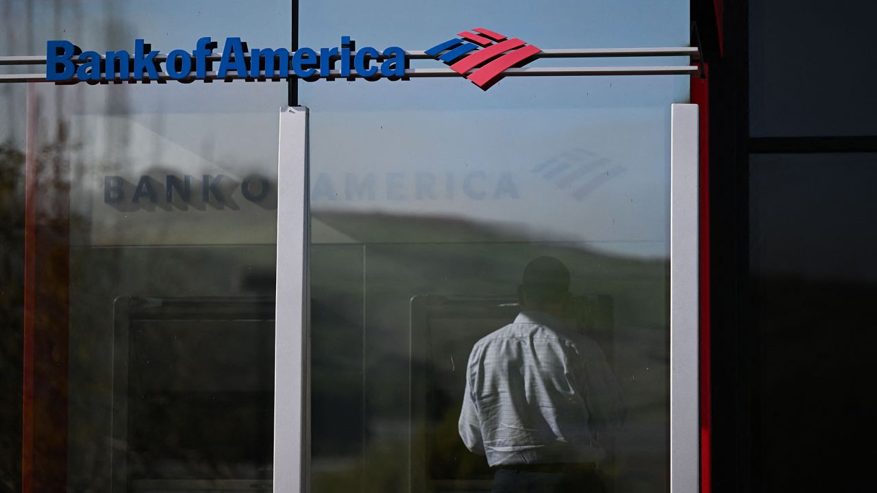 A customer uses an ATM outside of a Bank of America branch in Rolling Hills Estates, California, on March 13, 2023. 