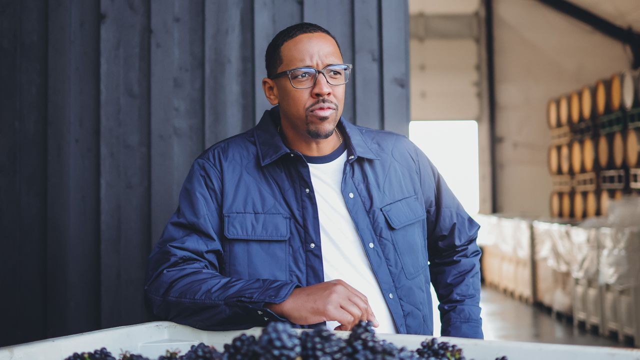 Former NBA player and owner of Chosen Family Wines, Channing Frye, tours Holstein Estate Vineyard where grapes are harvested for his company's wines.