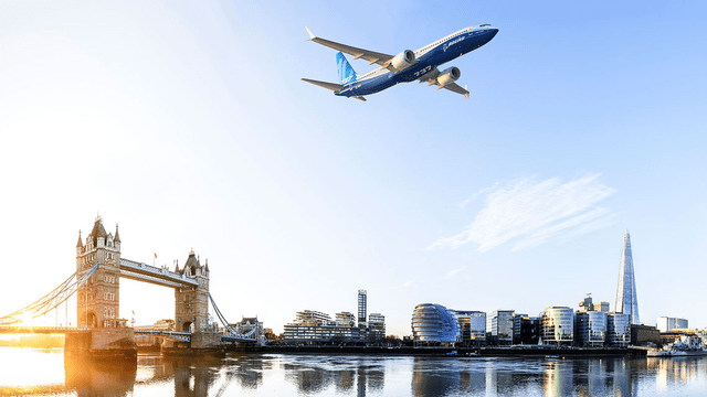 This image shows a Boeing 737 MAX airplane above London.