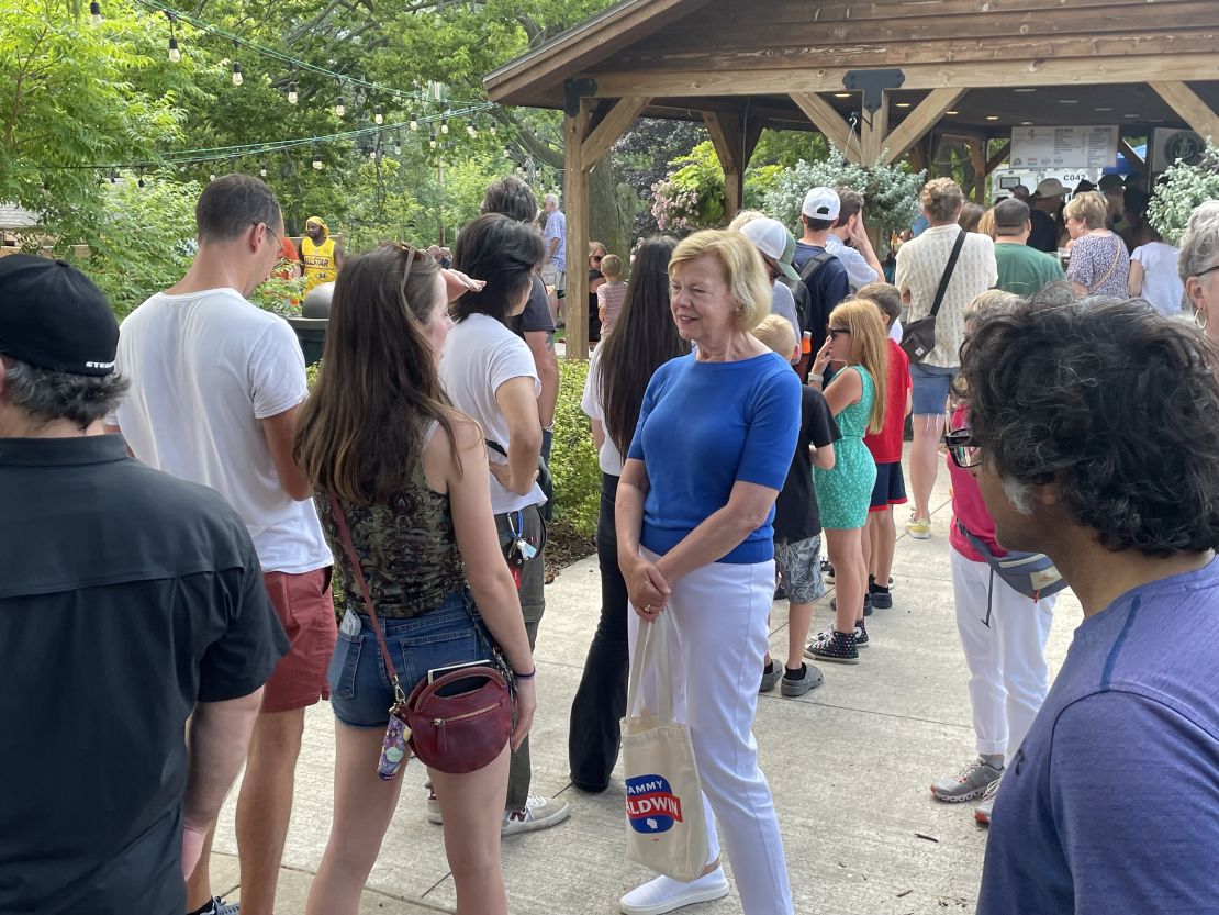 Baldwin talks with voters at the Port Fish Days festival in Port Washington, Wisconsin, on July 20, 2024.