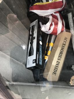 A rifle case and scope in the vehicle of a man who showed up at Dominion Voting Systems' headquarters.